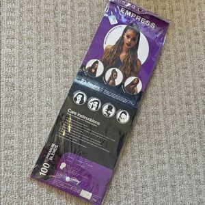 New in original packaging Darling Empress Collection long curly braid.